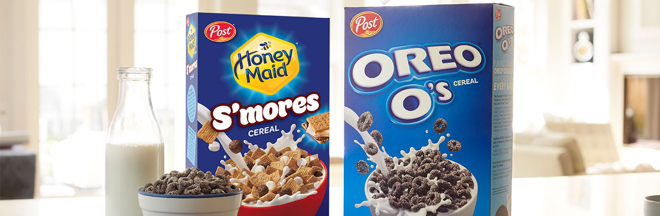 Post OREO O's cereal and Honeymaid S'mores cereal boxes next to a bowl of cereal